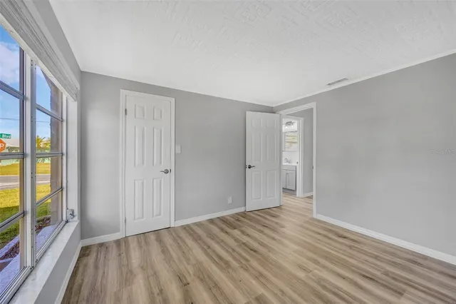 a view of kitchen with furniture and wooden floor