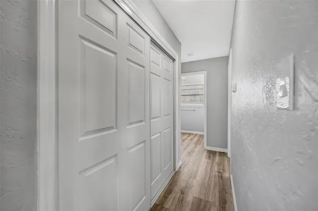 a kitchen with stainless steel appliances granite countertop a sink and refrigerator