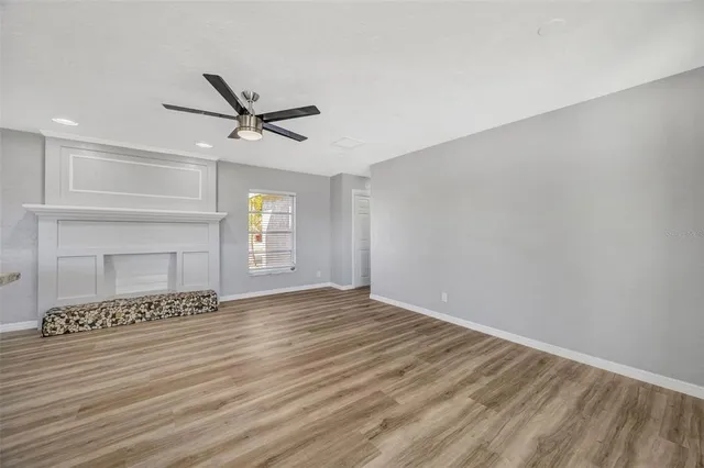 an aerial view of a houses with a lake view