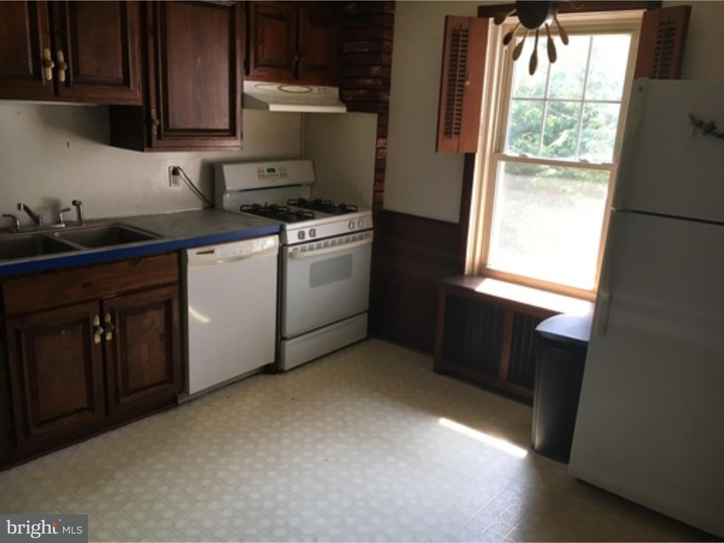 232 Carroll Street Reading, PA 19611 - Photo 4 of 9 a kitchen with a sink cabinets and window