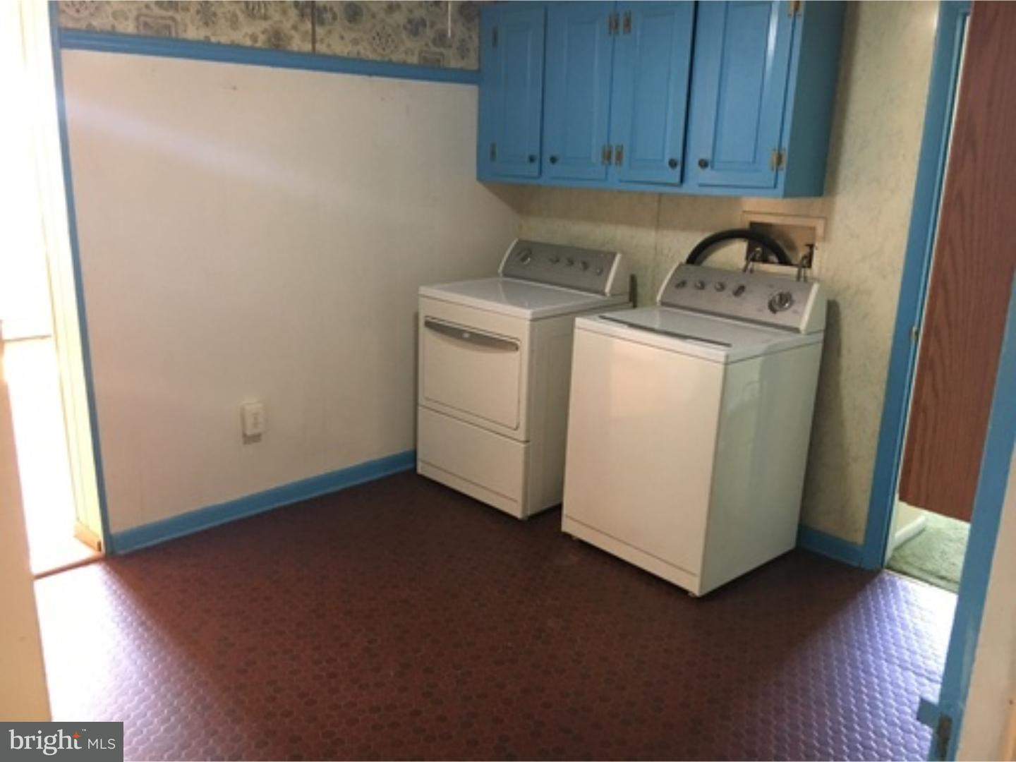 232 Carroll Street Reading, PA 19611 - Photo 5 of 9 a view of a storage & utility room with a washer dryer
