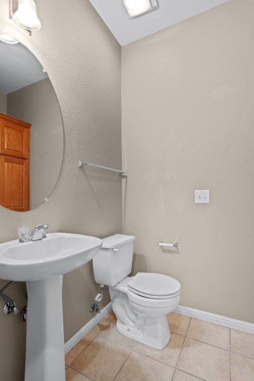 7502 Lazy Creek Drive, Unit B Austin, TX 78724 - Photo 11 of 24 a bathroom with a toilet a sink and mirror