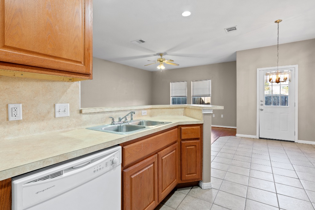 7502 Lazy Creek Drive, Unit B Austin, TX 78724 - Photo 7 of 24 a kitchen with a sink and cabinets
