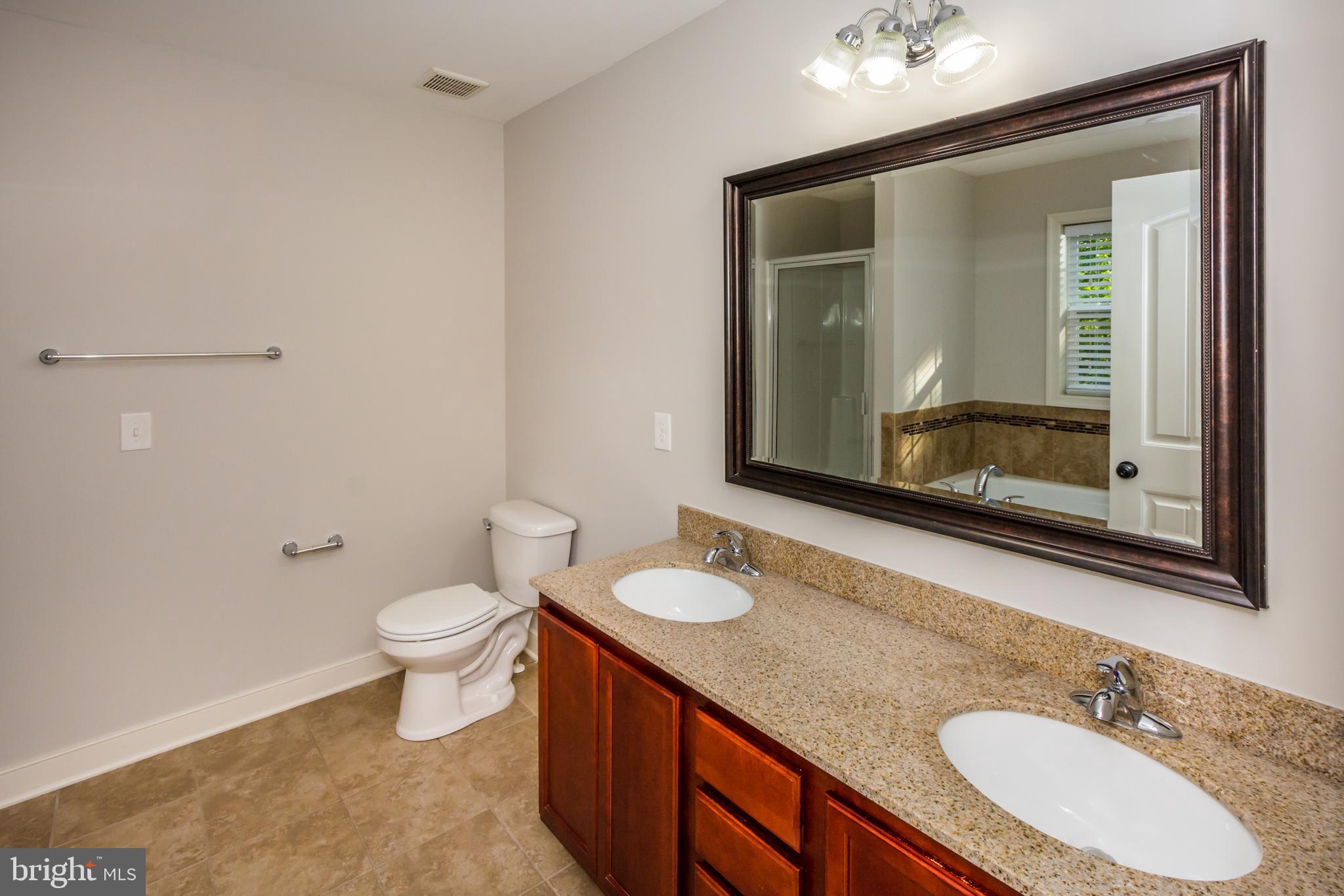 4010 Ward Road Pasadena, MD 21122 - Photo 26 of 39 Owner's beautiful bathroom. Granite counter