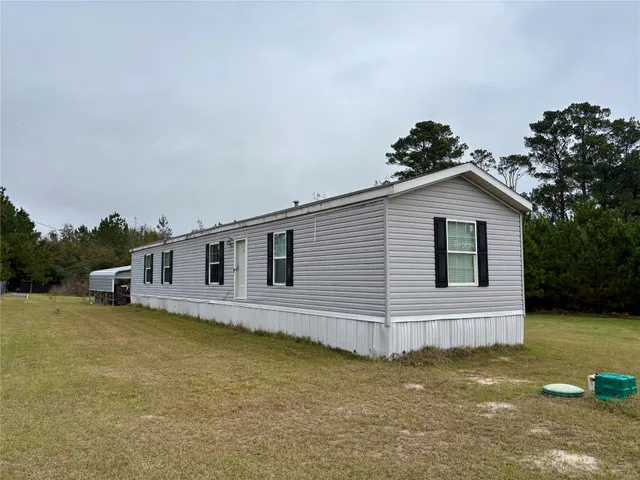 a house with trees in the background