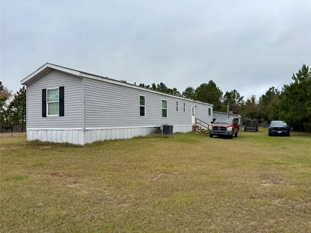 a view of a lake with a big yard
