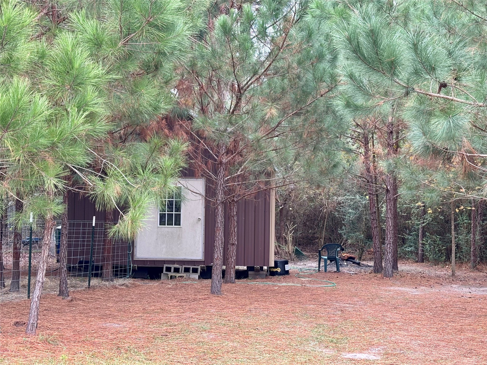 707 Bill Rasbeary Road Groveton, TX 75845 - Photo 20 of 48 a view of a house with a snow in the yard
