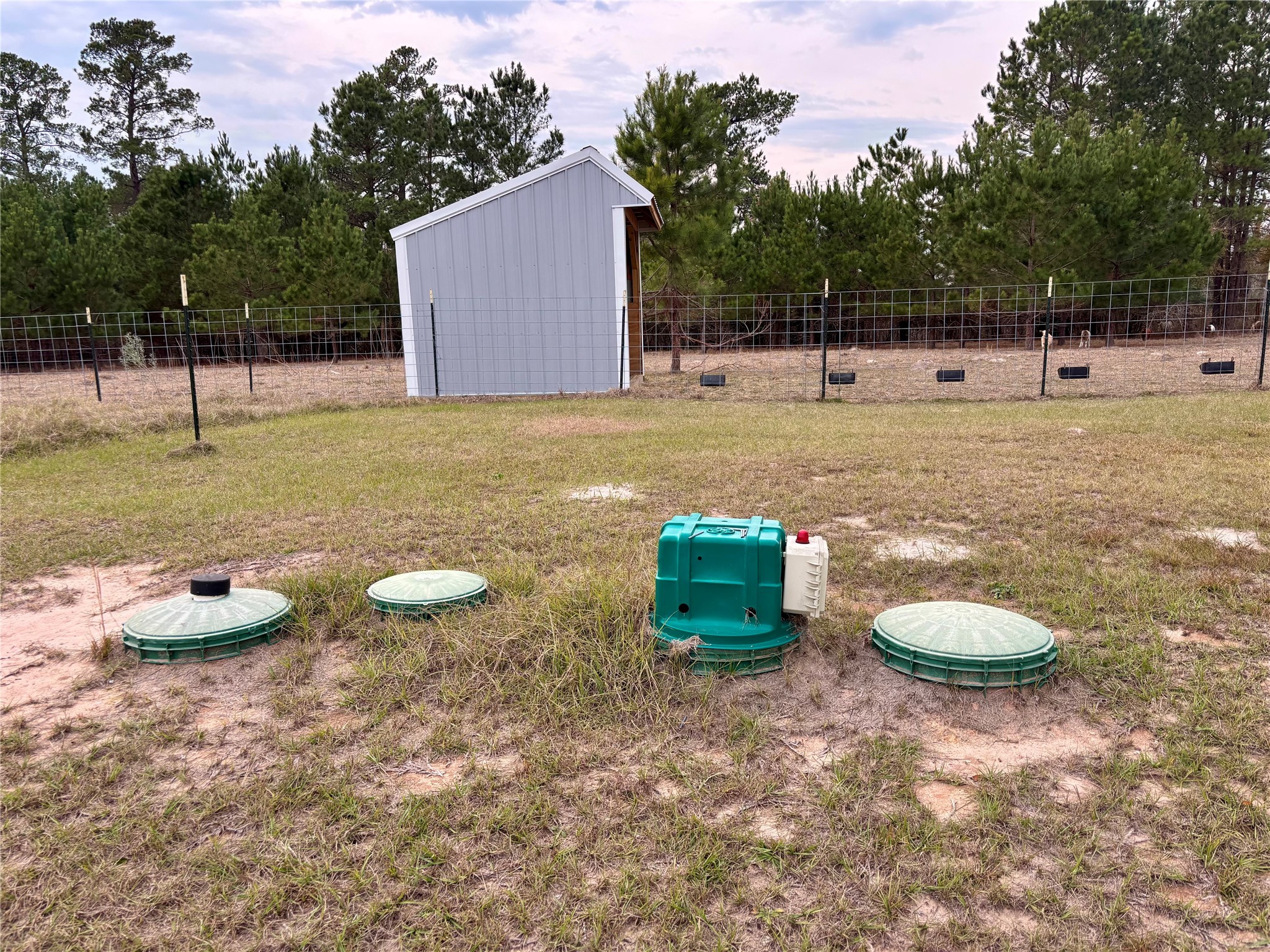 707 Bill Rasbeary Road Groveton, TX 75845 - Photo 23 of 48 a view of a backyard with table and chairs
