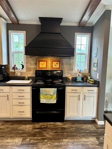 a kitchen with stainless steel appliances granite countertop a stove and a sink
