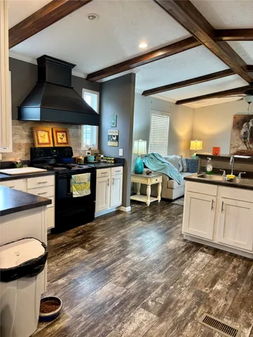 a view of a room with furniture and window