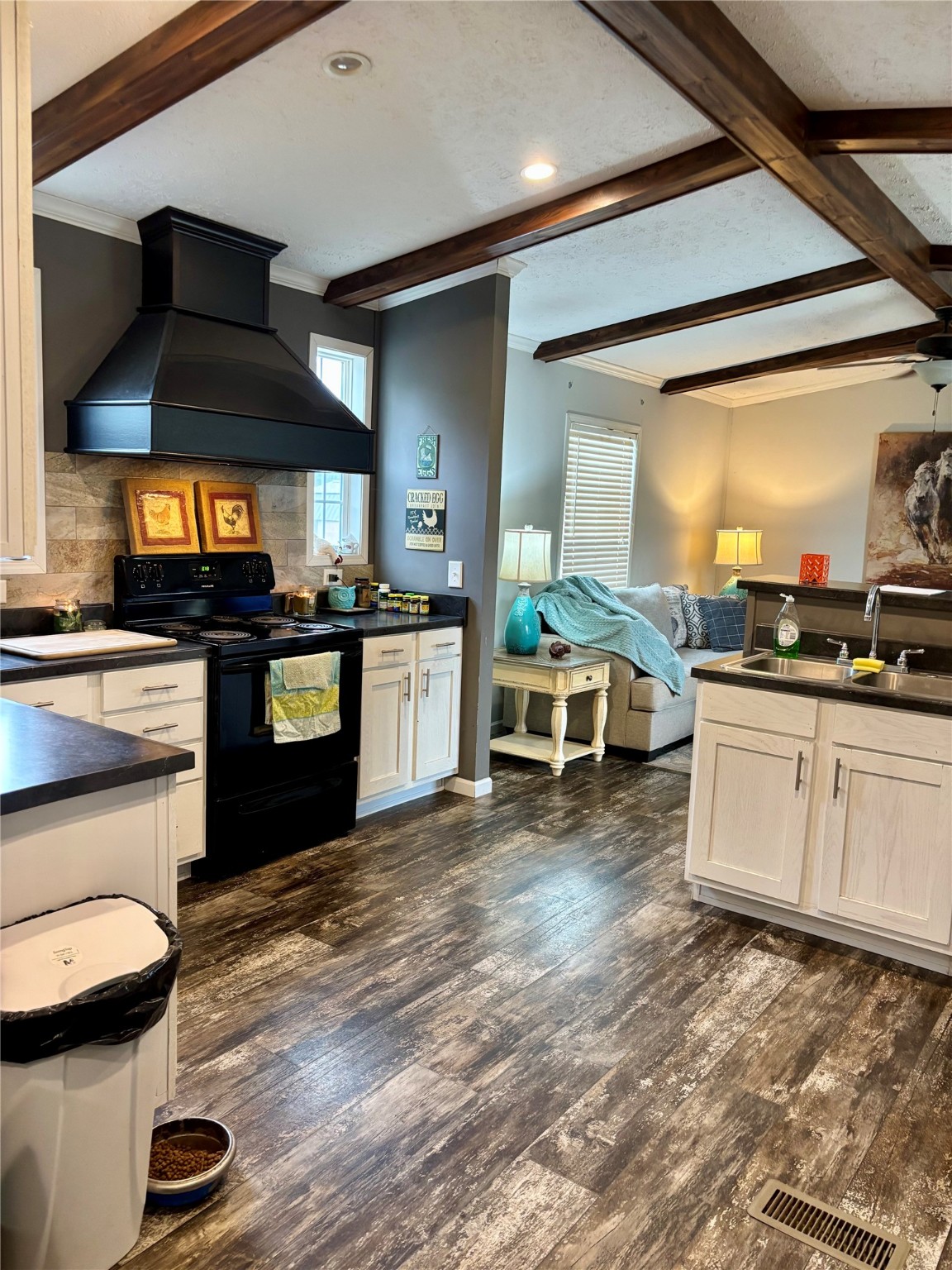 707 Bill Rasbeary Road Groveton, TX 75845 - Photo 25 of 48 a kitchen with stainless steel appliances granite countertop a stove and a sink