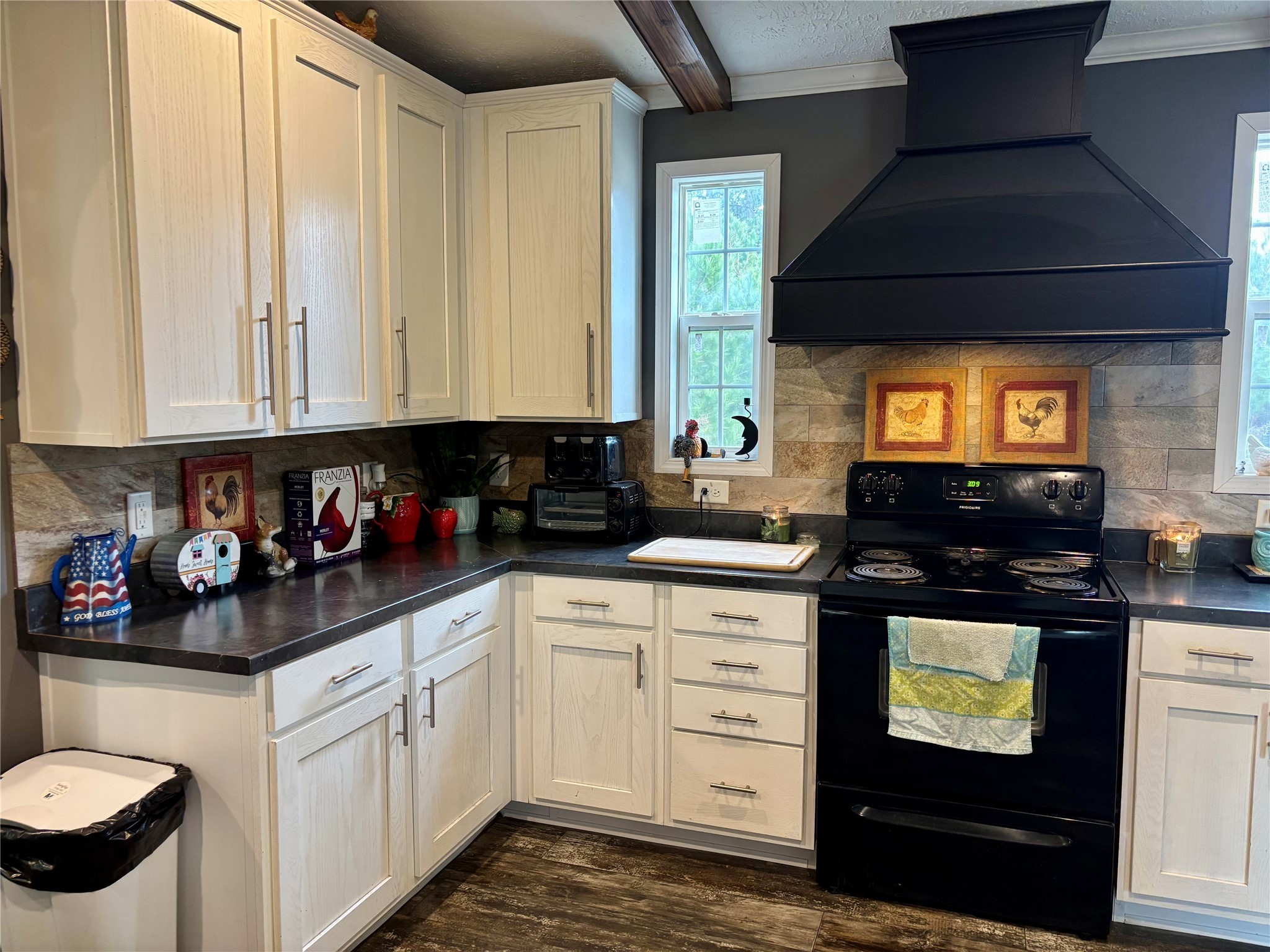 707 Bill Rasbeary Road Groveton, TX 75845 - Photo 29 of 48 a kitchen with stainless steel appliances white cabinets and a stove top oven