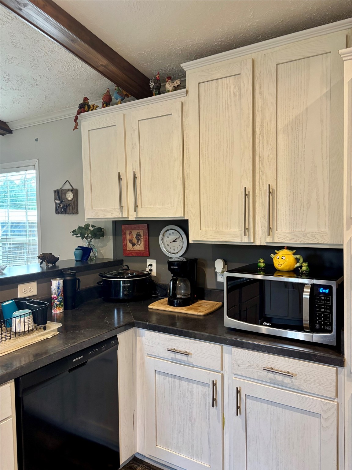 707 Bill Rasbeary Road Groveton, TX 75845 - Photo 31 of 48 a kitchen with stainless steel appliances granite countertop a sink a stove and cabinets