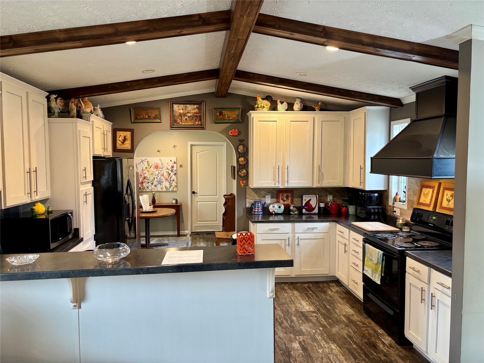 707 Bill Rasbeary Road Groveton, TX 75845 - Photo 34 of 48 a kitchen with a sink a stove and cabinets