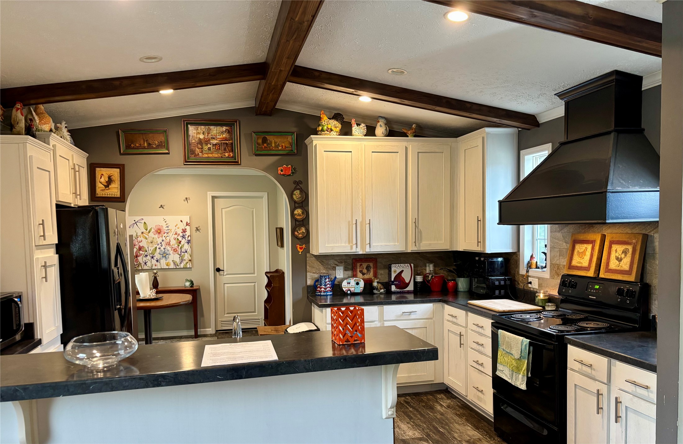 707 Bill Rasbeary Road Groveton, TX 75845 - Photo 35 of 48 a kitchen with stainless steel appliances granite countertop a sink and cabinets