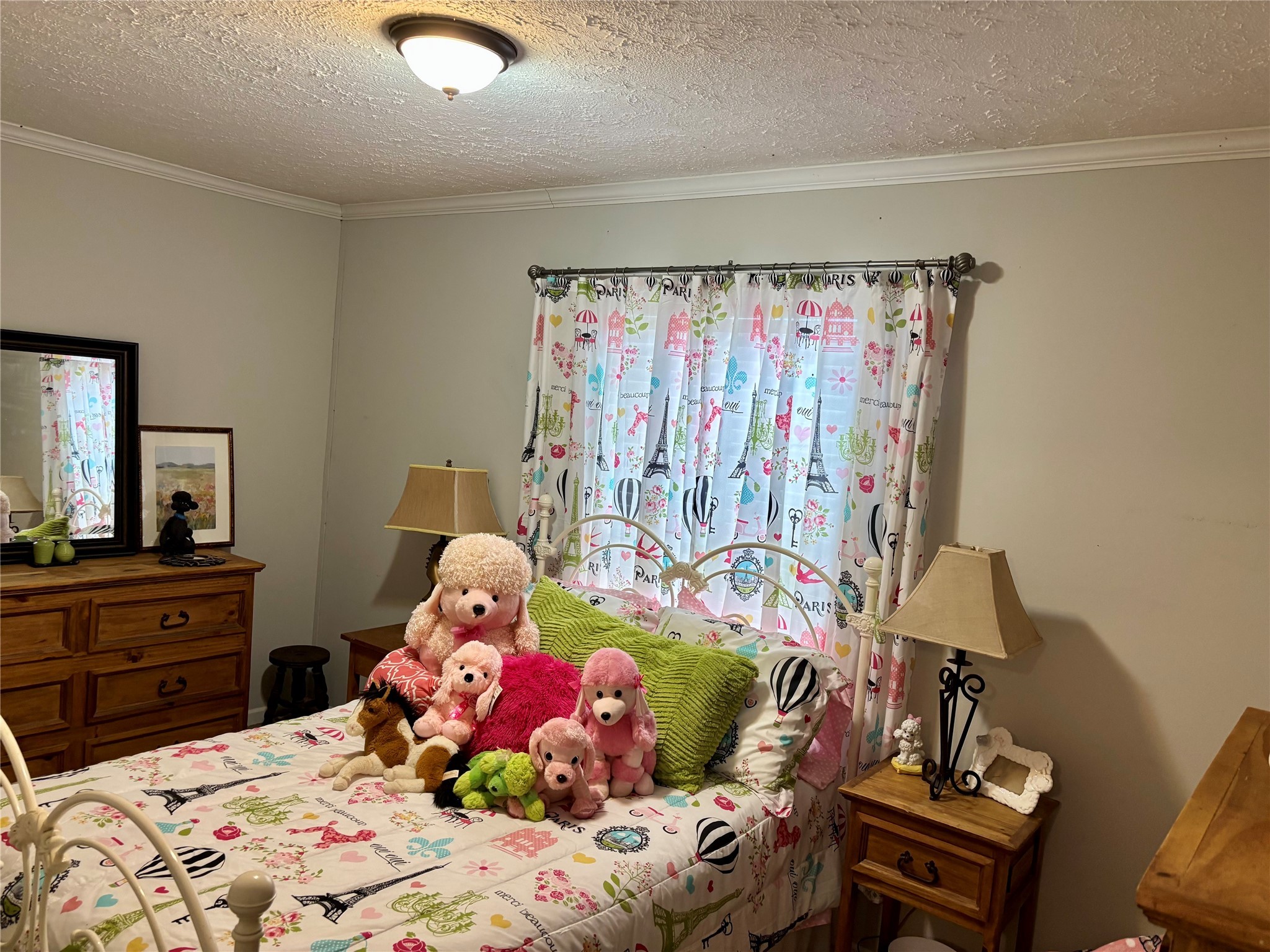 707 Bill Rasbeary Road Groveton, TX 75845 - Photo 39 of 48 a bedroom with a bed and a dresser in it