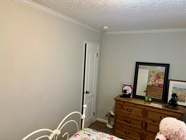 a view of a dining room with furniture and window