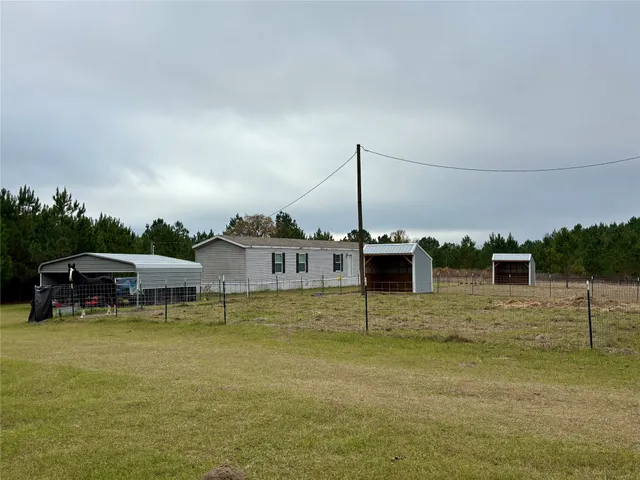 a view of a lake with a house