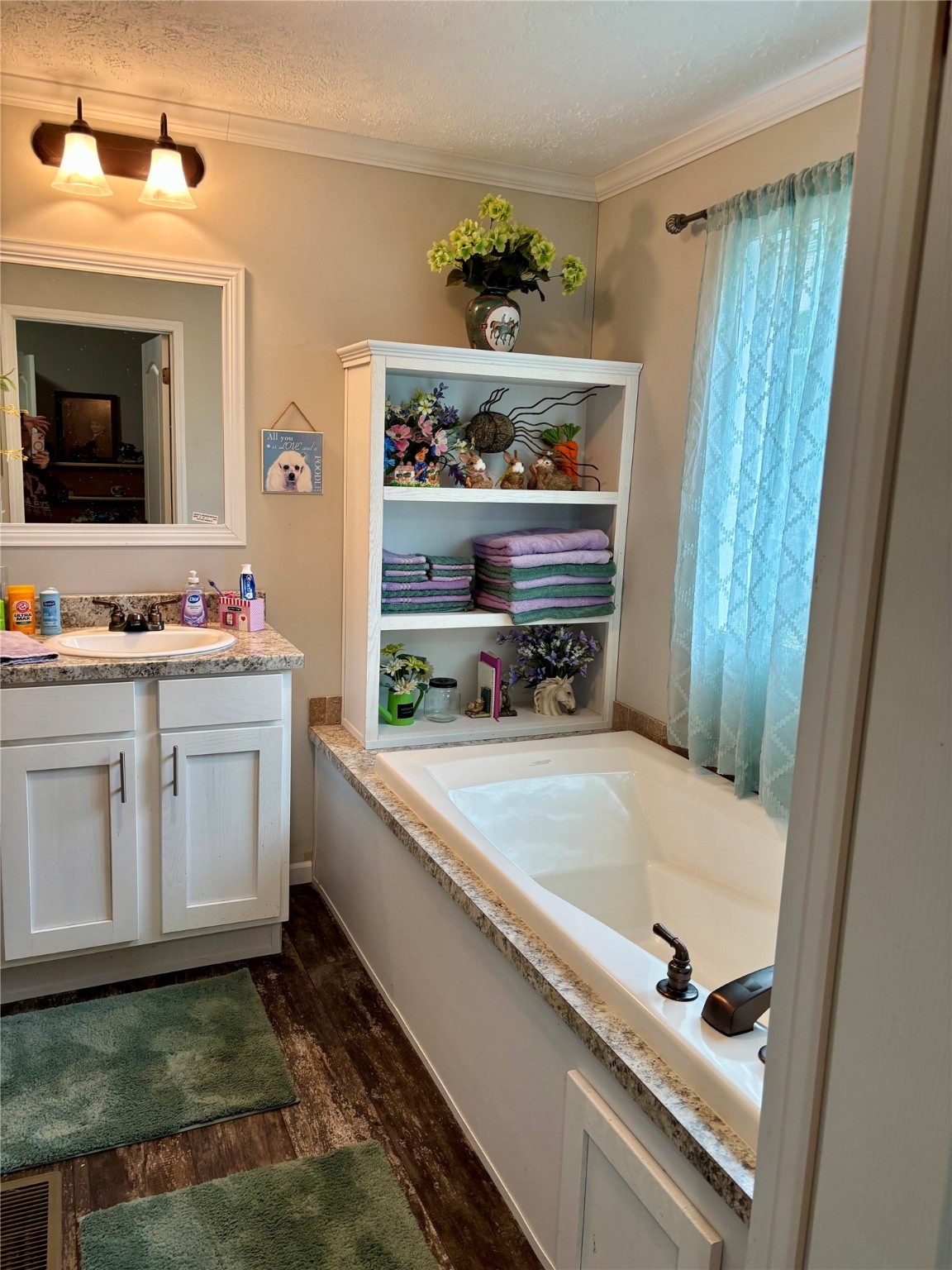 707 Bill Rasbeary Road Groveton, TX 75845 - Photo 45 of 48 a bathroom with a sink and a mirror