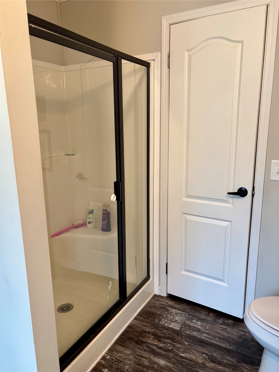 707 Bill Rasbeary Road Groveton, TX 75845 - Photo 46 of 48 a bathroom with a glass shower door