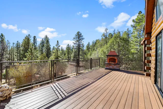 a view of balcony with wooden floor and outdoor seating