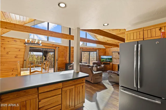 a living room with furniture ceiling fan and a rug