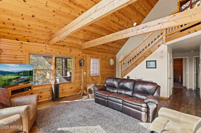 a bedroom with a bed and a ceiling fan