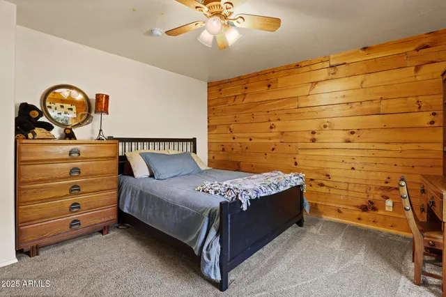 a bathroom with a tub shower and a sink