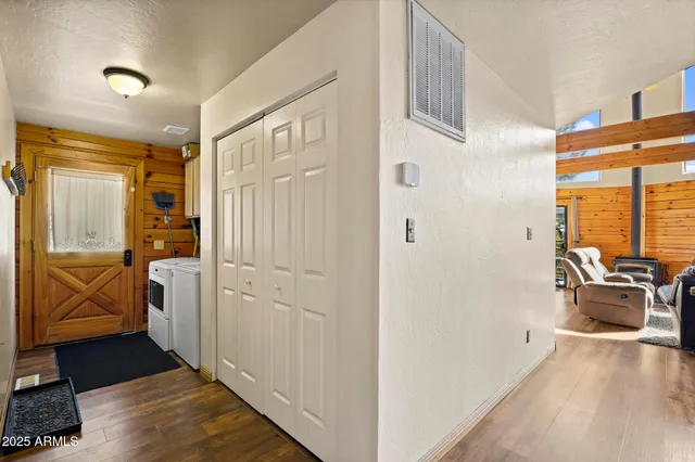 a bathroom with a granite countertop sink and a toilet