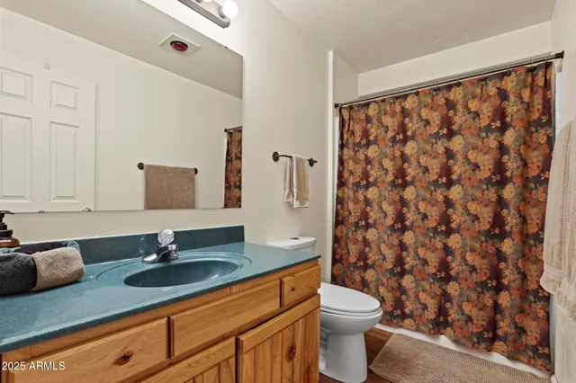 a view of a wooden chairs and bench in the balcony