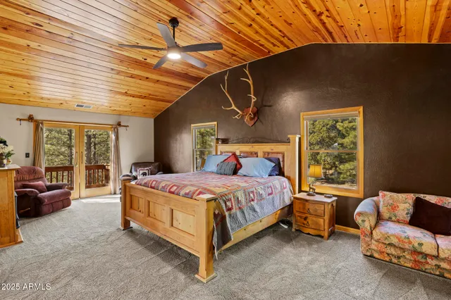 a bedroom with a bed and a fireplace