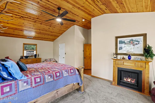 a bathroom with a sink a toilet a tub and shower