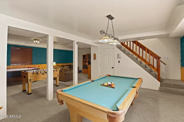 a living room with furniture and a rug