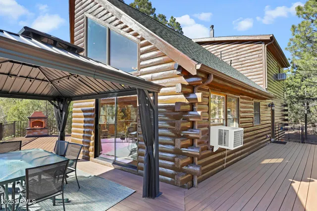 a view of a chairs and table in the balcony