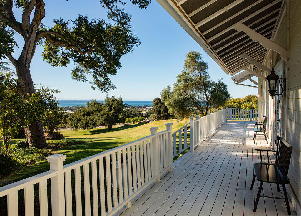 1835 Santa Monica Road Carpinteria, CA 93013 - Photo 1 of 31 a view of a balcony with wooden floor and fence
