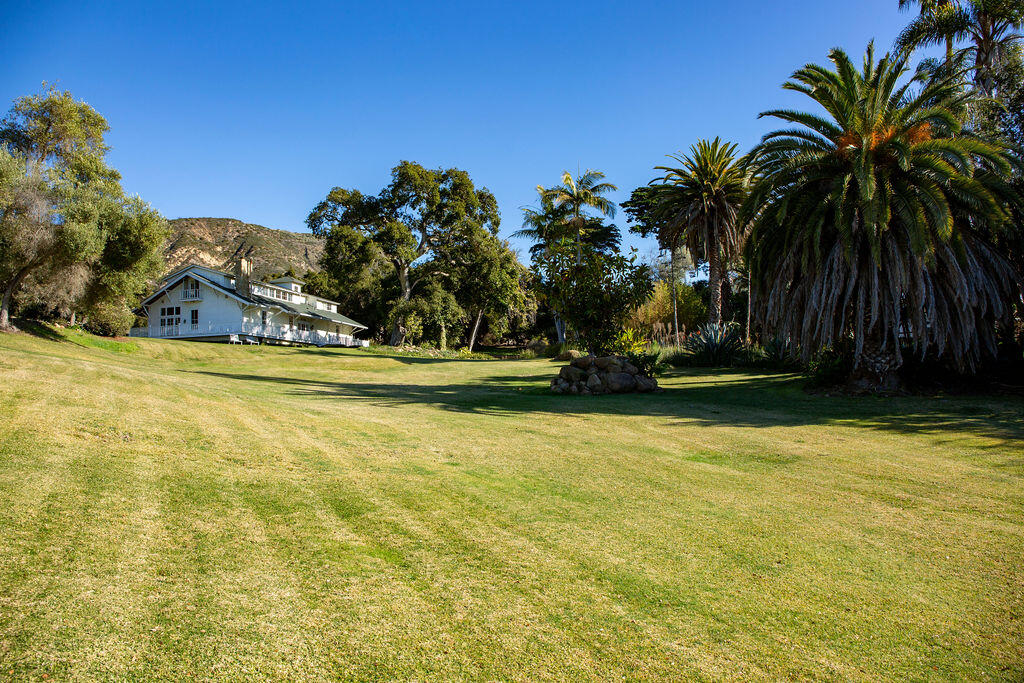 1835 Santa Monica Road Carpinteria, CA 93013 - Photo 26 of 31 a view of a swimming pool with a yard