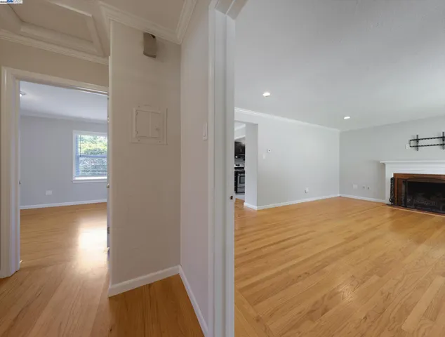 a view of a house with a wooden deck and a backyard