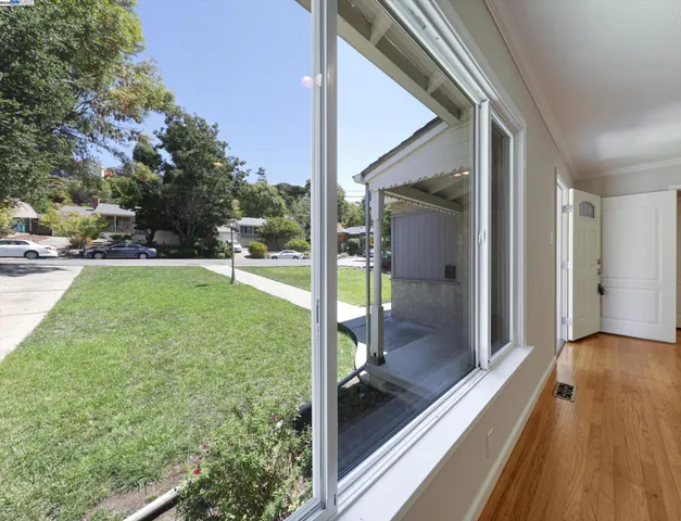 a view of hallway with wooden floor