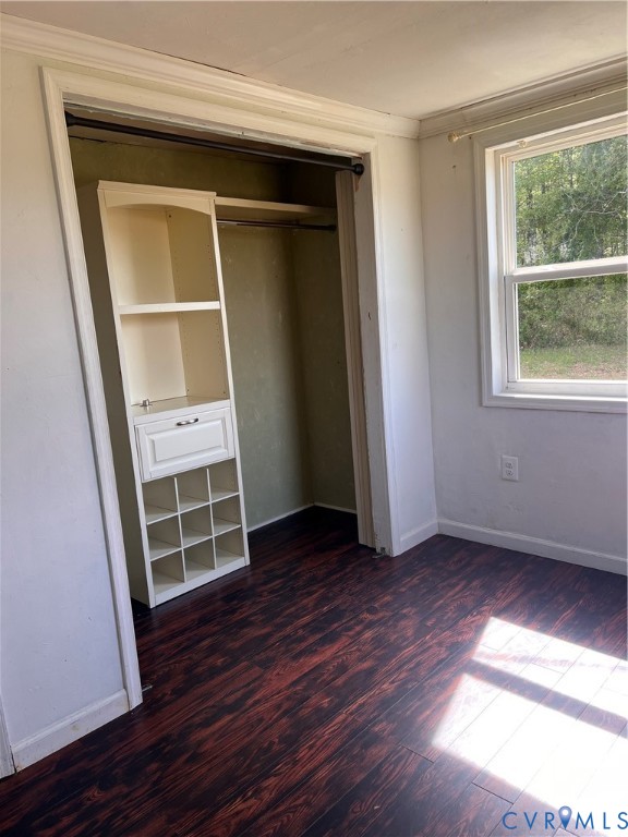 36210 Owens Grove Road Waverly, VA 23890 - Photo 18 of 24 an empty room with wooden floor and windows