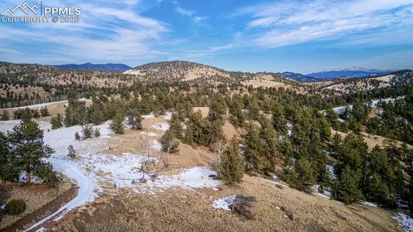 a view of mountain view with lots of trees
