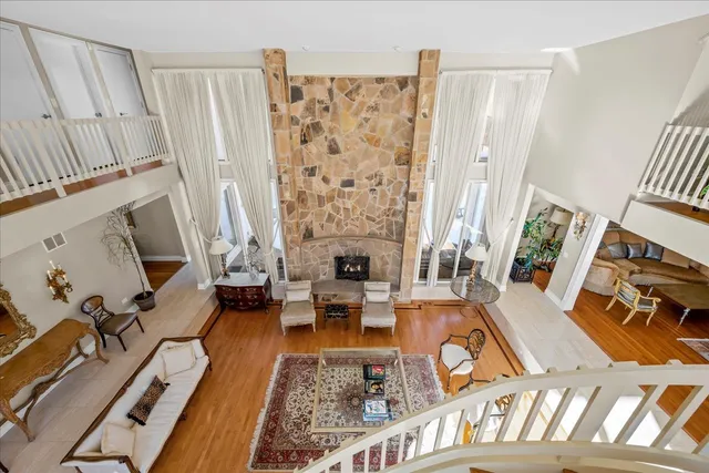 a living room with furniture fireplace and a flat screen tv