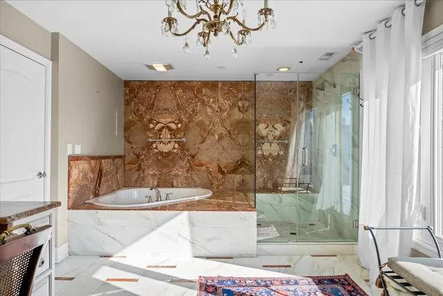a bathroom with a bathtub and shower