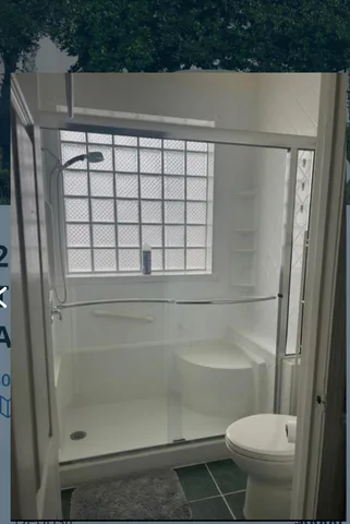 a bathroom with a bathtub and toilet