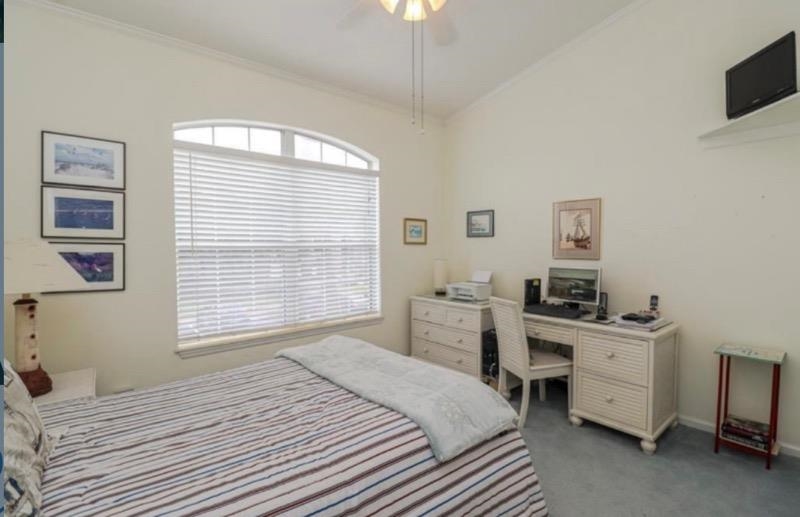 307 Augusta Circle St. Augustine, FL 32086 - Photo 26 of 31 a bedroom with a bed and a desk