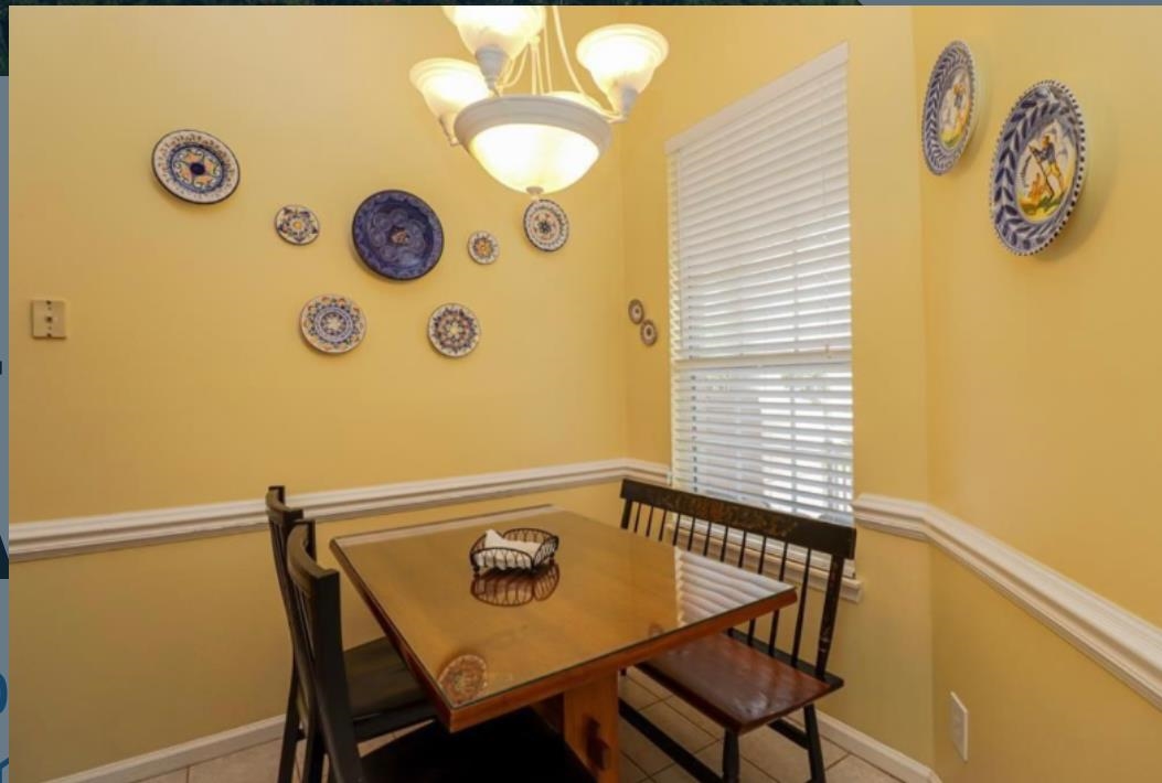 307 Augusta Circle St. Augustine, FL 32086 - Photo 5 of 31 a view of a dining room with chairs and a table