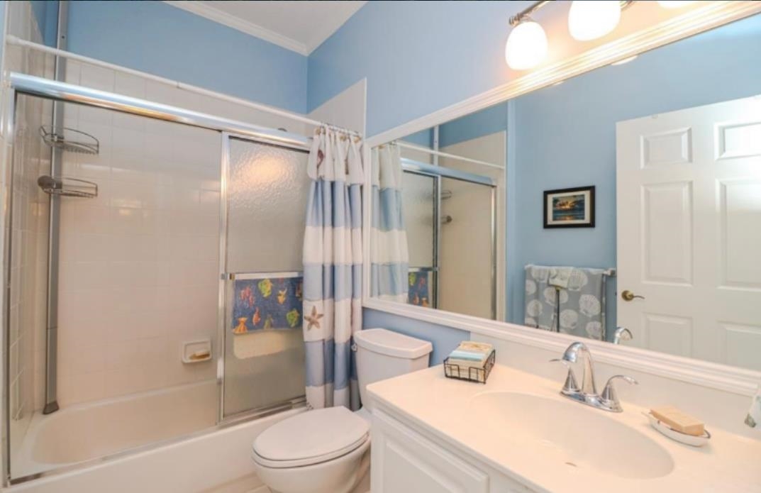 307 Augusta Circle St. Augustine, FL 32086 - Photo 9 of 31 a bathroom with a sink toilet and shower