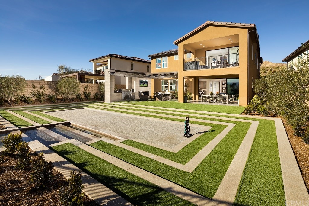 19022 Sark Place Saugus, CA 91350 - Photo 8 of 12 a front view of a house with a yard