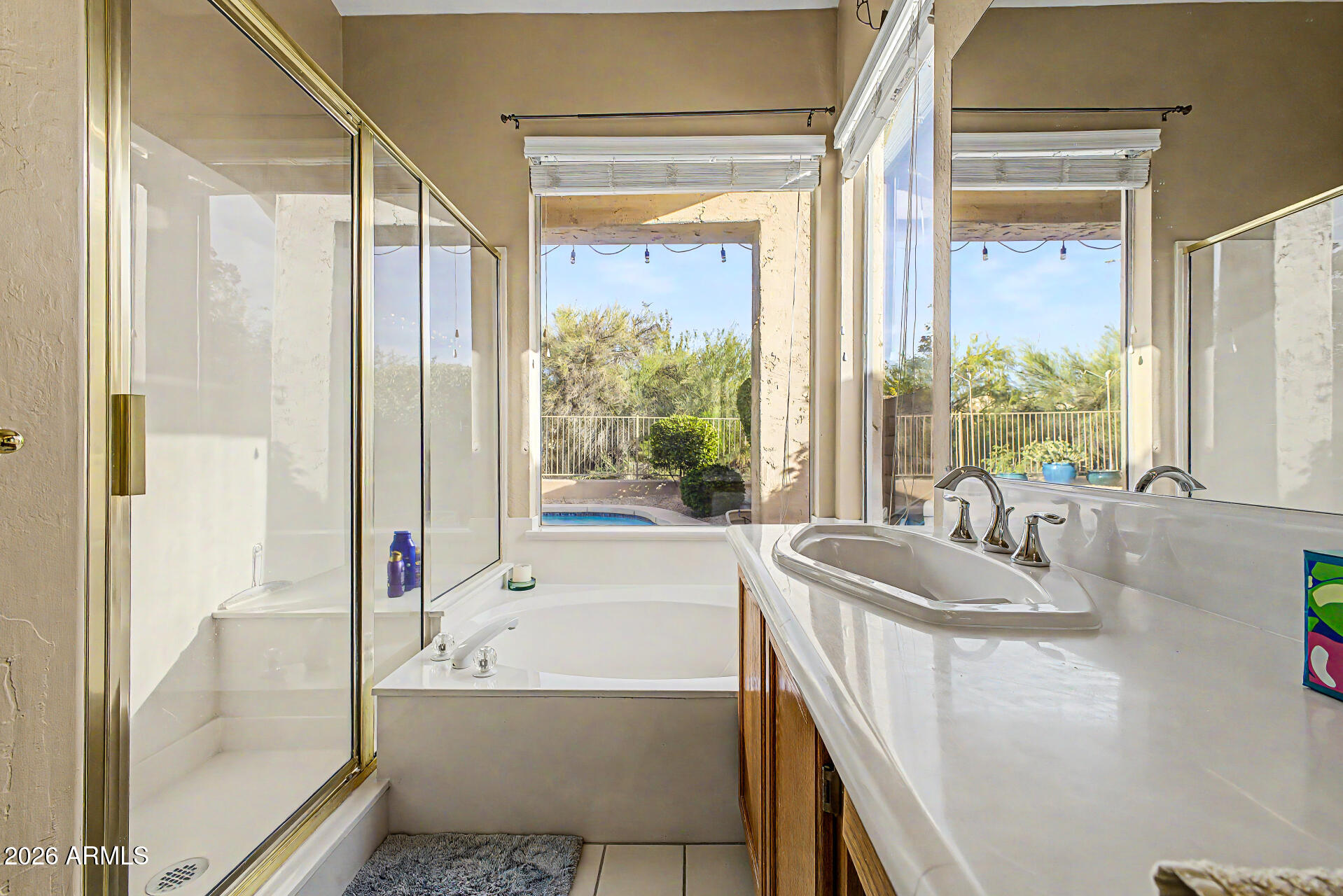 4309 East Rancho Caliente Drive Cave Creek, AZ 85331 - Photo 17 of 37 a bathroom with a granite countertop tub and a sink