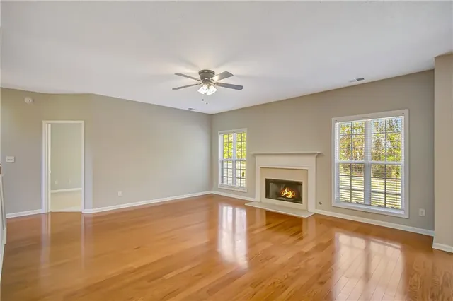 a kitchen with stainless steel appliances granite countertop white cabinets a sink and a oven