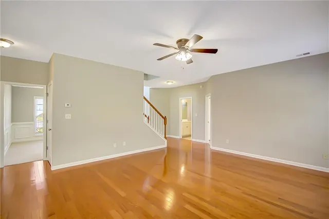 a kitchen with granite countertop a sink a counter top space and cabinets
